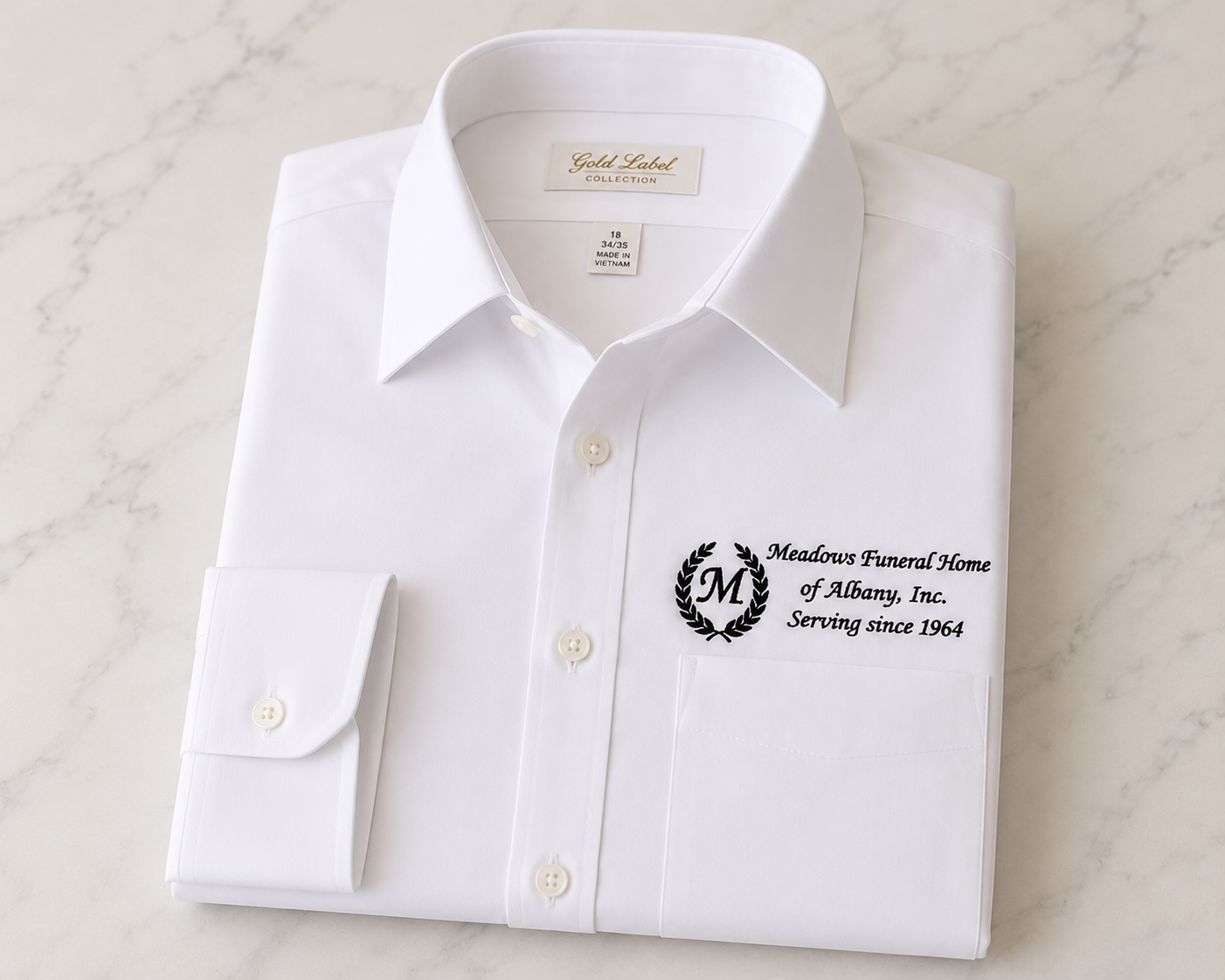 White dress shirt with custom business logo embroidery by Kisa's Limitless Creations in Albany, Georgia